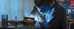 a man welding a piece of metal